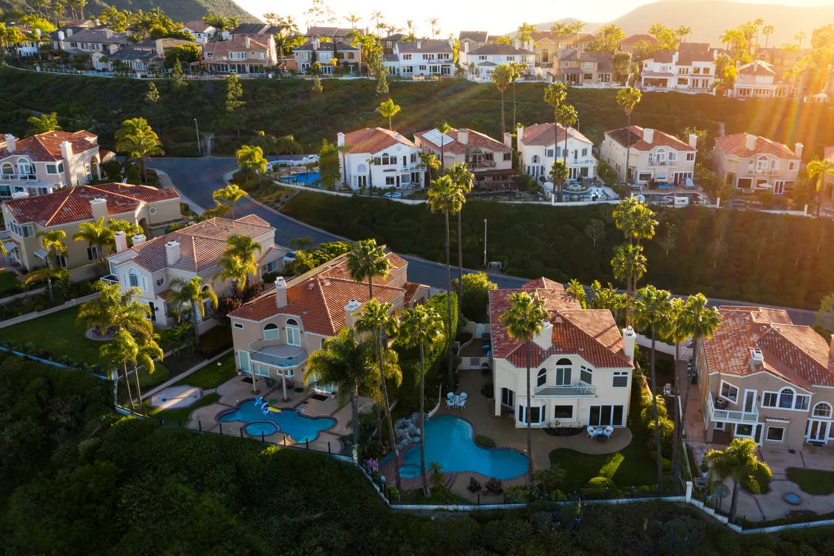 Aerial view of South Orange County's Laguna Niguel, California, a residential area with nice properties, palms, swimming pools, in the U.S. A wealth themed stock photo.
